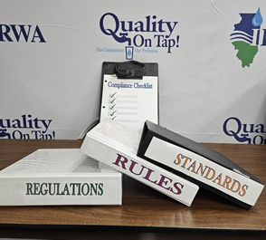 photo of binders and compliance checklist